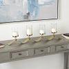The Novogratz 4-Slot Gold Stainless Steel Metal 4 Candle Hurricane Lamp with Wavy Base - The Novogratz